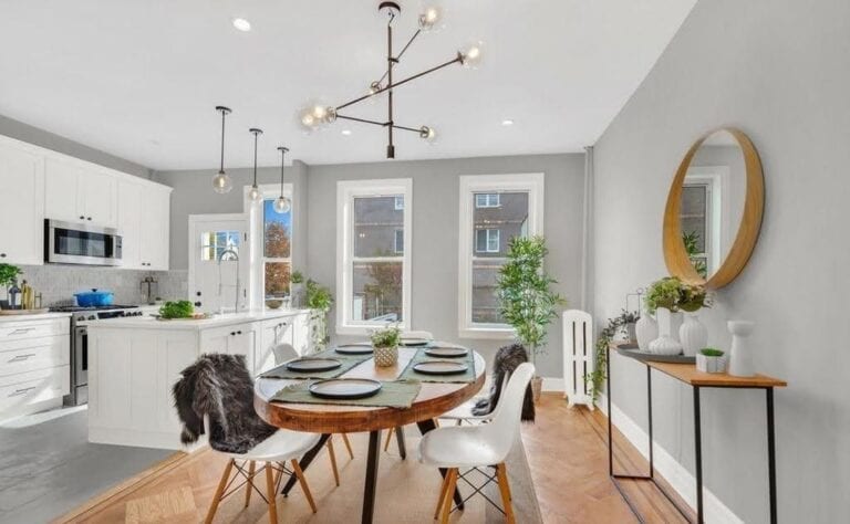Kitchen after renovation — modern luxury white cabinets and bright finishes